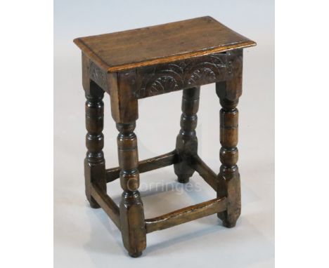 A James I oak joint stool, with carved frieze and turned legs, 1ft 3.5in x 9in. H.1ft 8.5in.