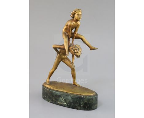 Professor Otto Poertzel. A bronze group of two boys playing leapfrog, signed, on green marble plinth, height 9in.