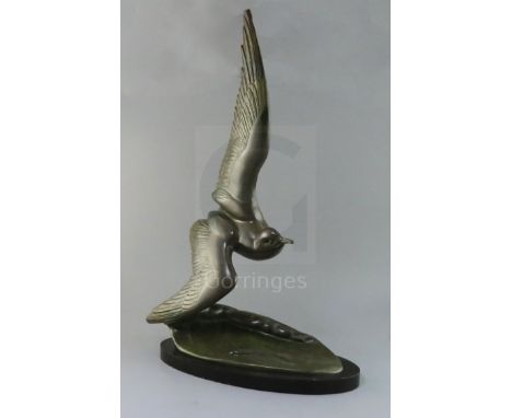 Irene Rochard. An Art Deco bronze model of a seagull flying over a wave, signed in the bronze, on black marble plinth, height