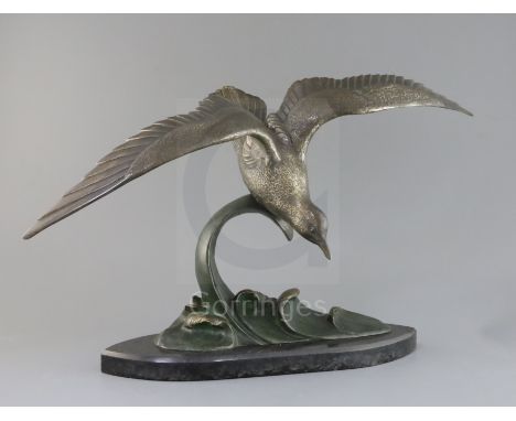 Irene Rochard. An Art Deco bronze model of a seagull flying above waves, signed in the bronze, on black marble plinth, height