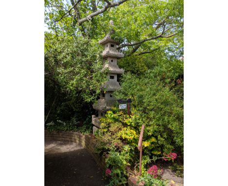 A carved pink granite six tier pagoda garden lantern, Height 10ftViewing by arrangement.