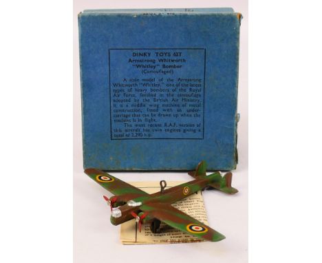 Dinky Toys - A boxed pre-war Dinky Toys #62t Armstrong Whitworth 'Whitley' Bomber. The model in camouflage with yellow rounde