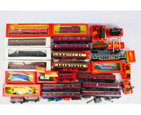 Hornby - Tri-ang - An assortment of coaches and rolling stock to include 7 Mk1 coaches, 2 cattle wagons, a Car Transporter wi