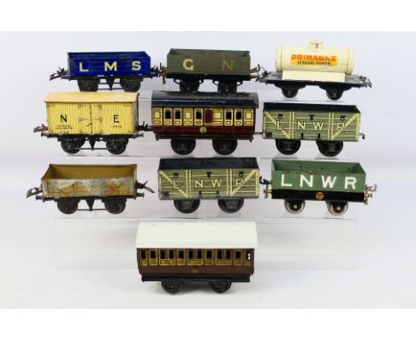 Hornby -  Ten unboxed O gauge tinplate passenger coaches and rolling stock to include a Primagaz Tanker, an LNWR 5-plank wago