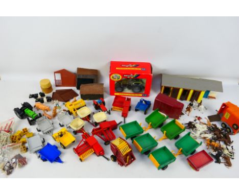 Britains - A boxed Britains #00038 Hurlmann SX1500 Tractor with a collection of unboxed and playworn Britains farm vehicles, 