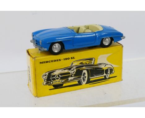 Marklin - A boxed Mercedes 190 SL in light blue # 8025. The car shows light signs of use but the windscreen and steering whee