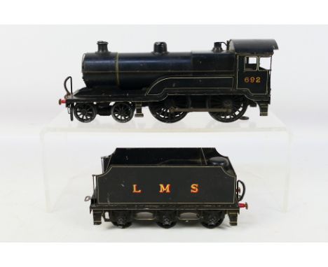 The Leeds Model Co - A 3 rail electric O gauge 4-4-0 locomotive number 692 in LMS black livery. It shows some signs of age an