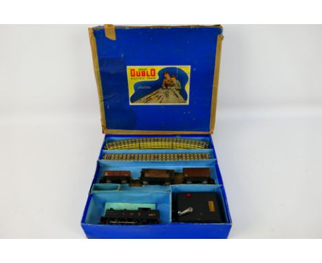 Hornby - A boxed Dublo Electric Trains Set # EDG7 with a 3-rail 0-6-2 tank engine number 6917 and 3 x wagons. The items show 