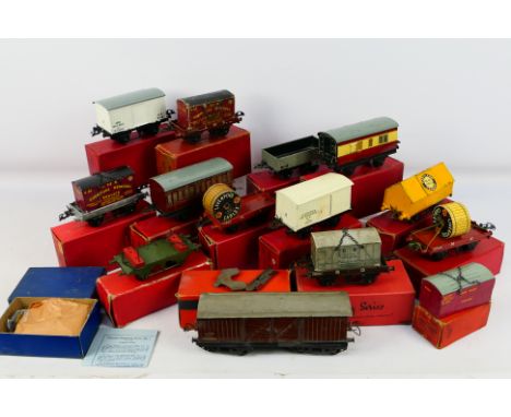 Hornby - Meccano - A collection of mostly boxed O gauge rolling stock including flat truck with container, cement truck, refr