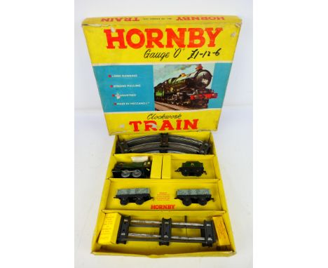 Hornby -  A boxed clockwork O gauge Goods Set No.20. The locomotive and wagons appear unused and Mint, the key is still in it