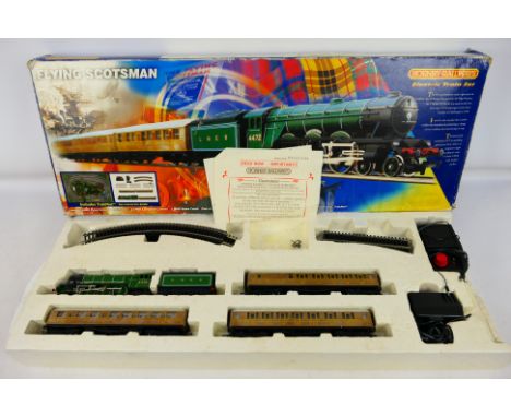 Hornby - A OO gauge Flying Scotsman Electric train set R823. The Loco and coaches appear to be in very good-excellent conditi