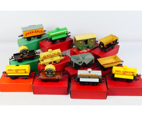 Hornby - A collection of 12 x O gauge rolling stock including, Saxa salt wagon, Manchester Oil Refinery tank wagon, side tipp