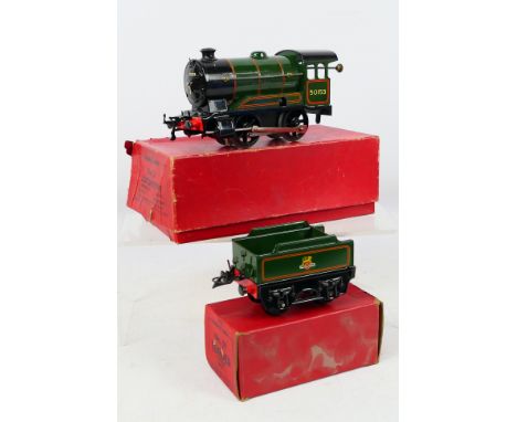 Hornby - A boxed O gauge clockwork Type 51 locomotive and tender number 50153 in British Railways dark green livery. They sho