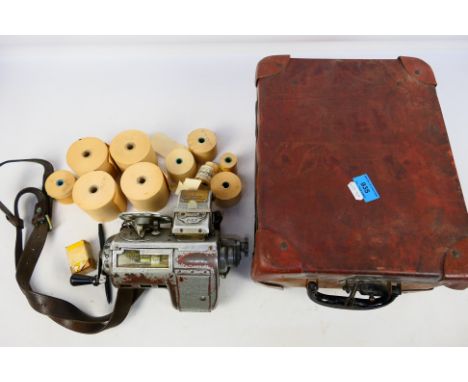 A vintage Mycalex bus ticket machine P47 together with a selection of ticket rolls in a fitted case marked QA-41