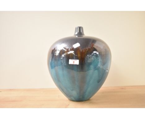 A large globular studio pottery vase, decorated in deep turquoise and bronze metallic glaze, unmarked to base, h32cm.
&nbsp;
