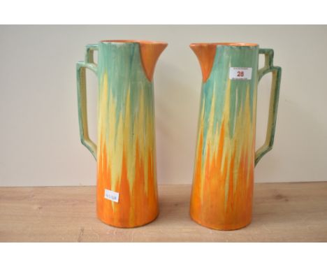 A pair of vintage Wadeheath pottery jugs in the Art deco style, decorated with orange, yellow and green dripware colouring, i