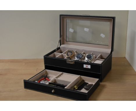 A Songmics watch display and storage box, having two layers and containing three wristwatches including Invicta along with a 