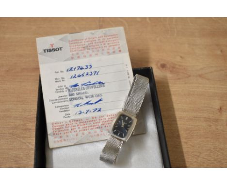 A vintage Tissot wristwatch, the rectangular dial having baton numerals on a stainless steel mesh bracelet strap, with Tissot