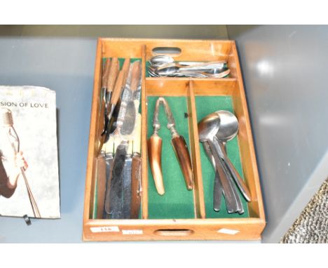 A vintage sectional cutlery tray, sold together with to a stainless steel and horn nut cracker, Dansk designs knifes, spoons 