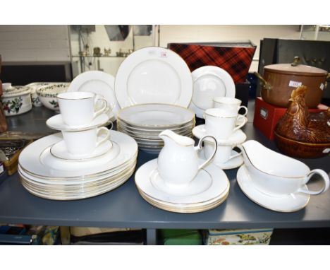 A Royal Doulton signature Gold pattern tea service in ice white with gilt edging, to include soup bowls, gravy jug, cups, sau