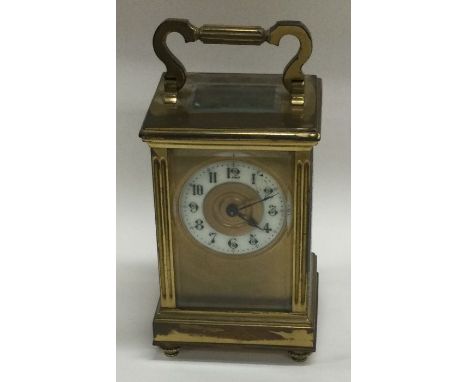 A small brass carriage clock together with an MOP card case. Est. £20 - £30.
