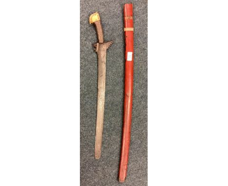 A large Eastern sword with silver handle. Est. £30 - £50.