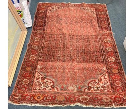 A good red tapestry rug with floral border. Approx. 203 cms x 134 cms. Est. £60 - £80.