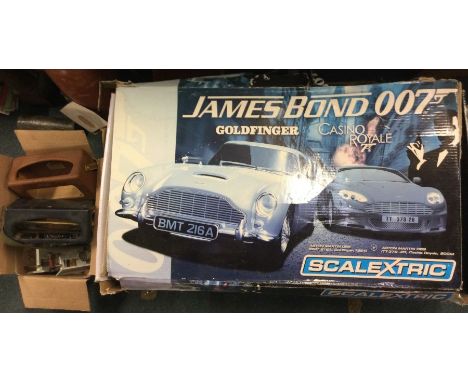 Three Scalextric sets together with a Roberts radio. Est. £15 - £20.