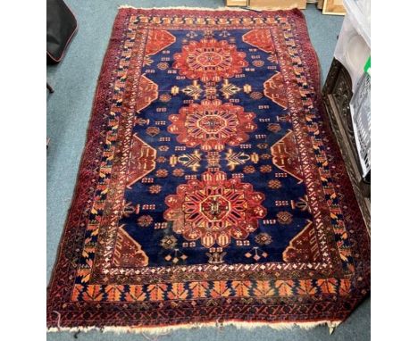 A good tapestry rug in blue ground. Approx. 126 cms x 200 cms. Est. £60 - £80.