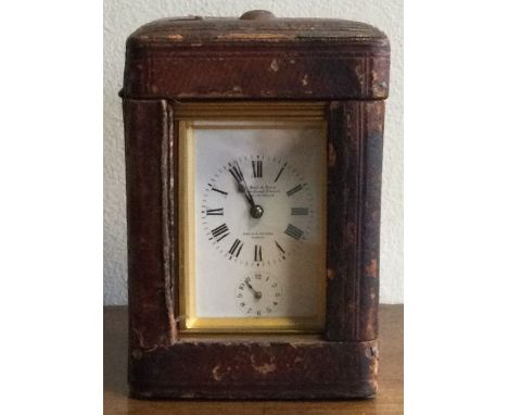 A good French carriage clock with white enamel dial. By Le Roy. Est. £150 - £200.