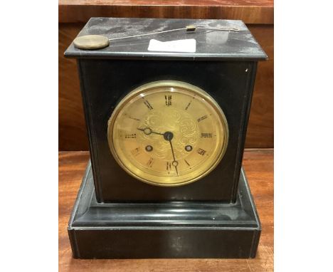 An old slate mantle clock with gilt dial. Est. £10 - £20.