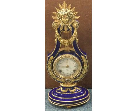 A good gilt and porcelain Swiss made mantle clock. Est. £30 - £50.