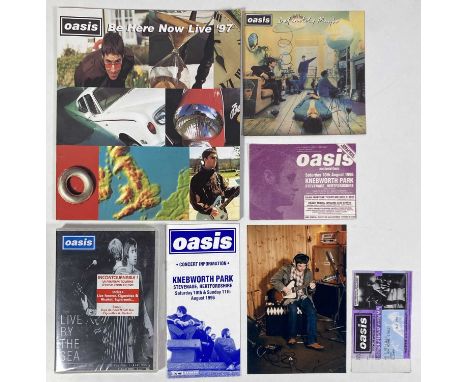 Oasis ephemera to include: a cutting depicting the 'Definitely Maybe' cover (approx 17 x 17cm) signed by Liam and Noel Gallag
