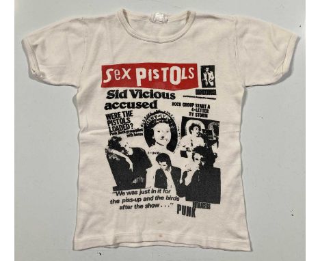 An original t-shirt likely c late 1970s, early 1980s with Sex Pistols newspaper print design. Size label illegible. Pit to pi