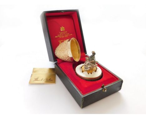STUART DEVLIN.  A Stuart Devlin textured silver gilt Surprise egg, opening to reveal a silver & silver gilt clown's head, 'en