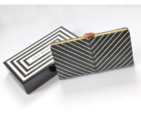 LULU GUINNESS. A Lulu Guinness diagonal stripes flat frame purse in black & chalk leather. An unused item still with original