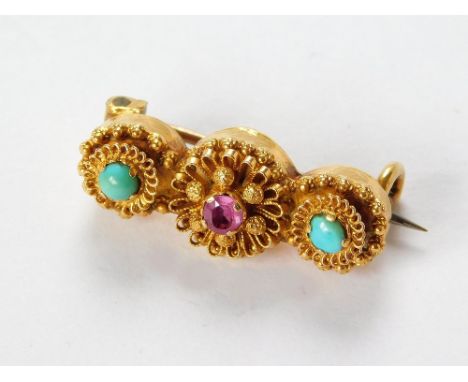 LACE PIN. A yellow metal, 19th century, cannetille work lace pin, set with a ruby & two turquoise stones. Width 2cm.  Please 