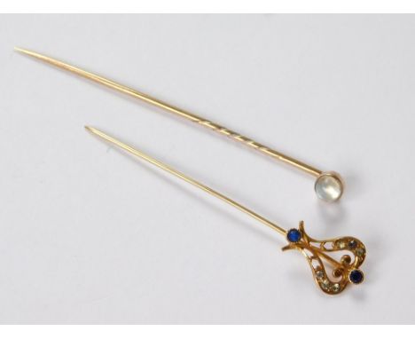 STICK PINS. A moonstone set stick pin & one other stick pin, set with blue & white paste stones.  Please note that all items 