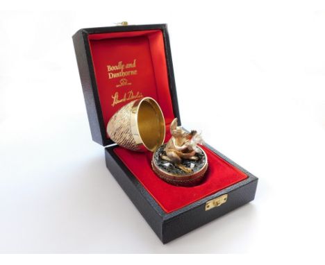STUART DEVLIN.  A Stuart Devlin textured silver gilt Surprise egg, opening to reveal a silver gilt kangaroo on a textured gro