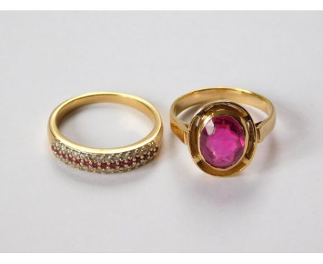 GOLD RINGS. A yellow metal (tests as 18ct. gold) ring, set a solitaire pink paste stone. Also, a yellow metal (tests as 18ct.