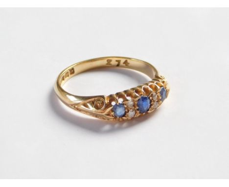 GOLD RING. A Victorian 18ct. gold, five stone sapphire & diamond ring. Approx. 3.9g. Size R.  Please note that all items in t