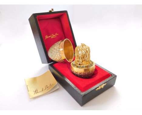 STUART DEVLIN.  A Stuart Devlin textured silver gilt Surprise egg, opening to reveal a silver & silver gilt pair of lovebirds