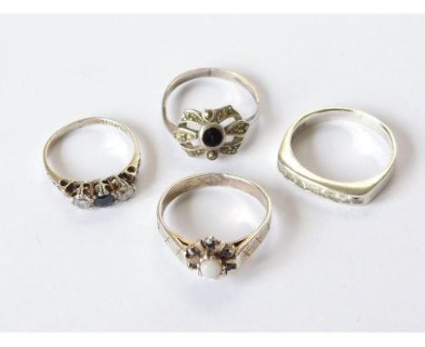 SILVER RINGS. Four silver dress rings set with marcasite, paste & opal.  Please note that all items in this auction are previ