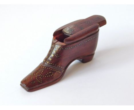 SHOE SNUFF BOX. A wooden shoe snuff box with sliding lid, the heel, sole, front & sides all with an arrangement of brass pin 