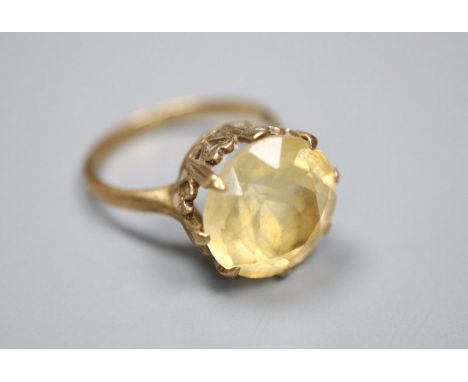 A 9ct and citrine set oval dress ring, size K, gross 2.9 grams,