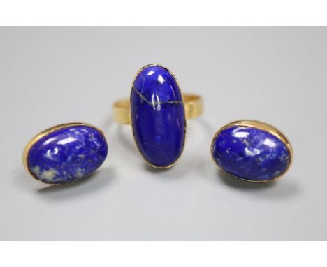 A Middle Eastern yellow metal and lapis lazuli oval dress ring, size N, and pair of matching earrings, gross 8.7 grams.