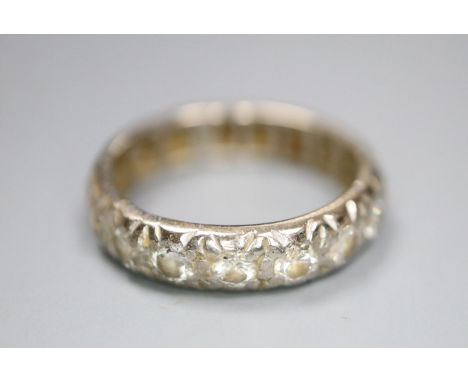 An 18ct white metal and diamond set full eternity ring, size N/O, gross 5.1 grams.