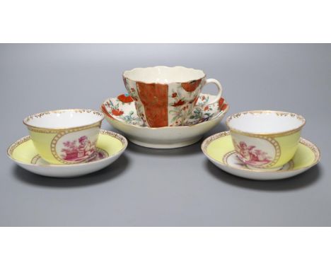A Worcester cup and saucer, late 18th century, and a pair of Meissen outside printed coffee cups and saucers, largest saucer 