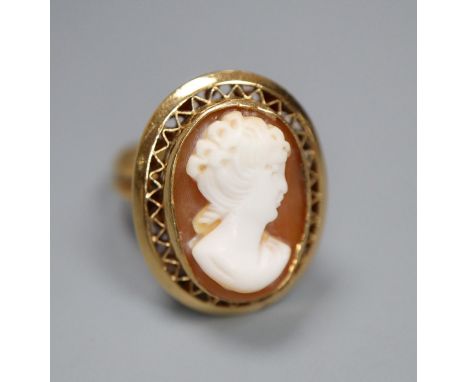 A modern 750 yellow metal and oval cameo shell set dress ring, carved with the bust of a lady to sinister, size O, gross 7.1 