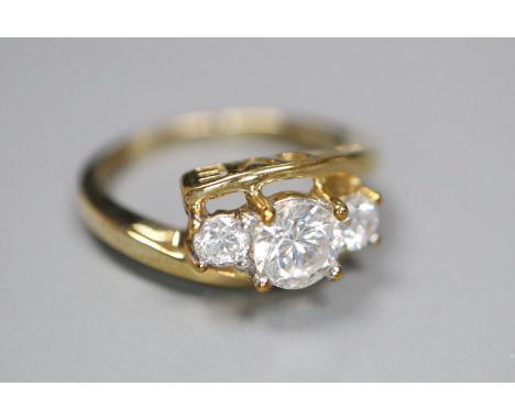 A 9ct gold and simulated diamond three stone ring, size J, gross 1.9 grams.